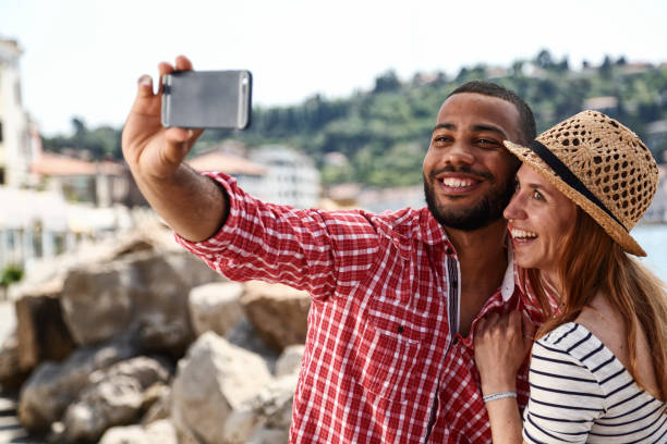 istock Tourists in a new city taking selfie 1416320561
