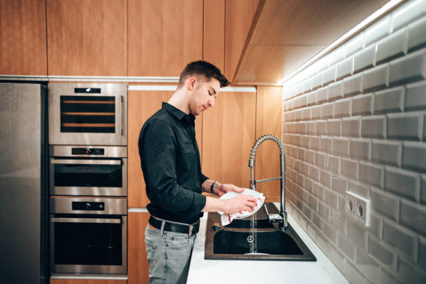 istock business man washing dishes 1416322213