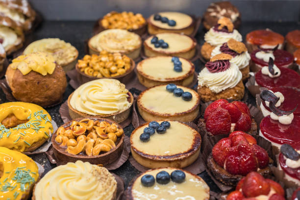 istock Fruit and berry cakes on paper napkins assorted. Side view from above. 1416327178
