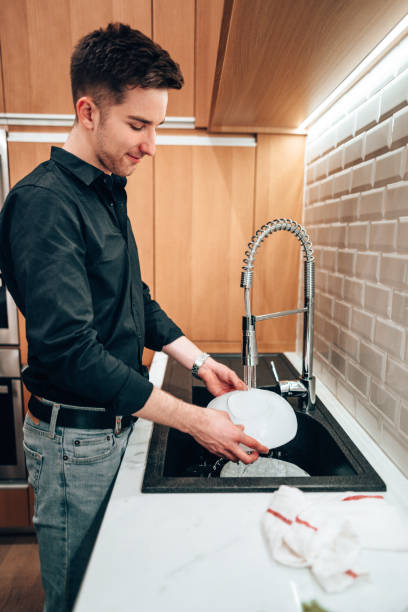 istock business man washing dishes 1416331009