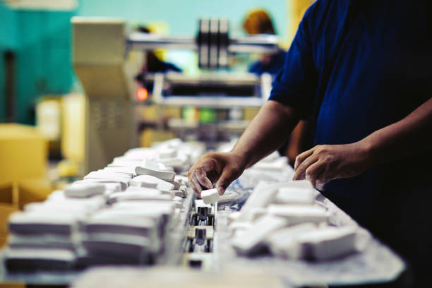 Small business semi-skilled production line workers stock photo