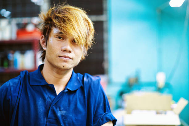 Factory worker looking at the camera for a photograph