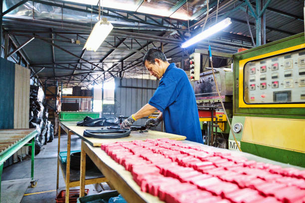 Recycling and Sustainability Image of a busy factory worker running routine tasks on the shopfloor south east asia choicepix stock pictures, royalty-free photos & images