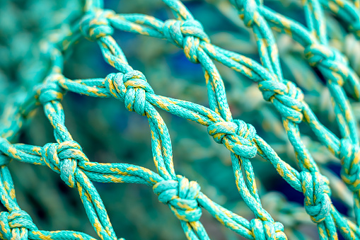 Close-up of a fishing net on a shipyard