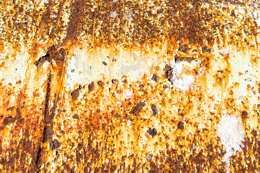 Close-up of painted metal plate with rust on a shipyard. With copy space. Shot with a 35-mm full-frame 61MP Sony A7R IV.