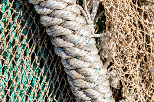 Thick rope and fishing nets on a shipyard. Shot with a 35-mm full-frame 61MP Sony A7R IV.
