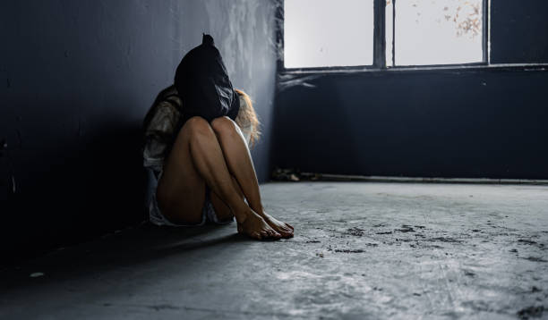 Hostage woman modle was captured by the villain. Criminal and villain concept. Hostage woman modle was captured by the villain. Criminal and villain concept. modle stock pictures, royalty-free photos & images