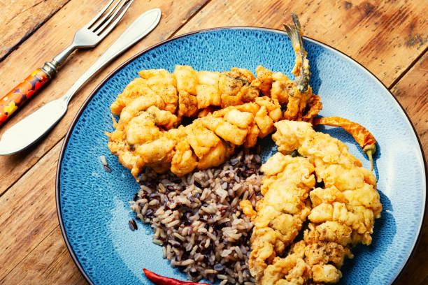 istock Deep fried sea bass with rice. 1416369658