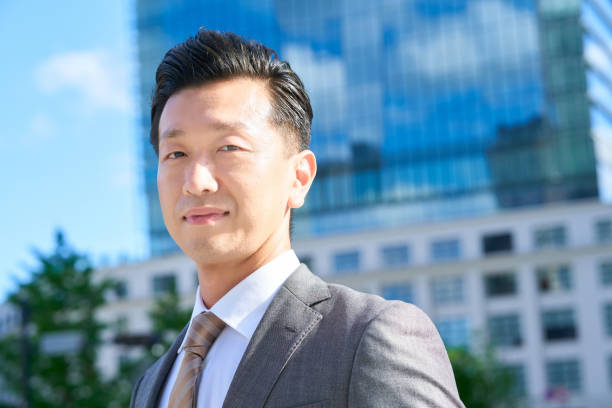 istock businessman standing in office district 1416378744