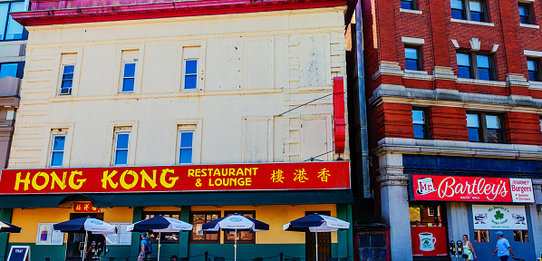 Cambridge, Massachusetts, USA - August 19, 2022: Famous Harvard Square restaurants on Massachusetts Avenue,  across from Harvard University's Harvard Yard campus. The Hong Kong Chinese restaurant and lounge (c. 1954) , and Mr. Bartley's Gourmet Burgers (c. 1960).