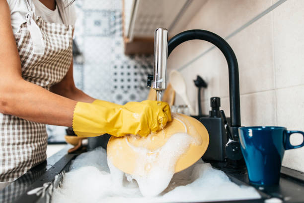 istock Housewife dish washing 1416387254