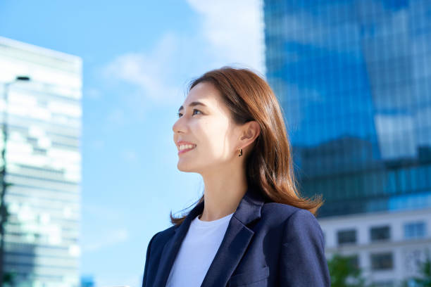 istock business woman standing in office district 1416387992