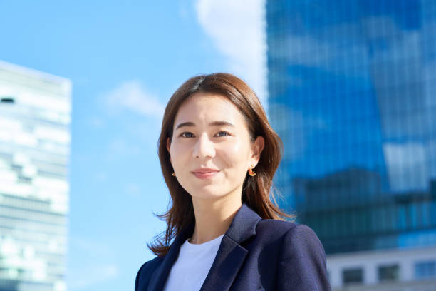 istock business woman standing in office district 1416390133