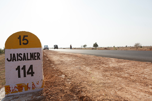 Milestone on the road to Jaisalmer, Thar Desert, Rajasthan, India, Asia