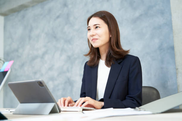 istock Business woman doing desk work with a smile 1416401582