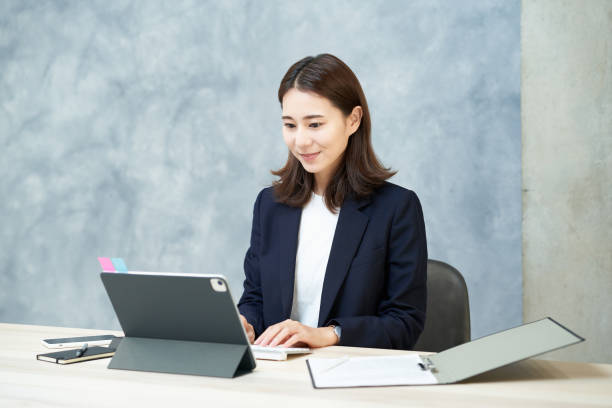 istock business woman doing desk work 1416404254