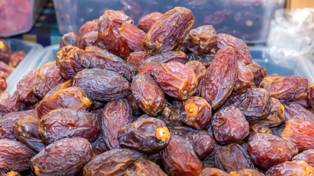 istock Dates are sold at a dried fruit market. Close-up 1416408606