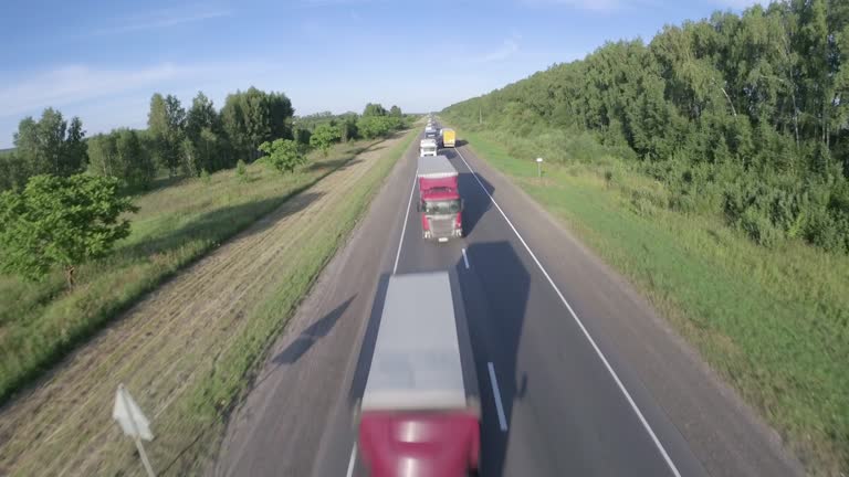 Road with trucks. Cargo transportation. Shooting from a drone.