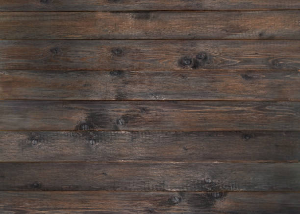 legno marrone scuro vecchio sfondo. tavole di legno strutturate con nodi e motivi naturali - knotted wood plank wall abstract texture foto e immagini stock