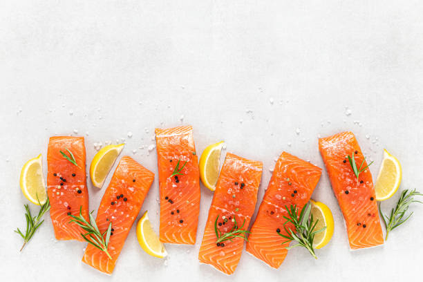 istock Salmon. Fresh raw salmon fish fillet on white background 1416417299