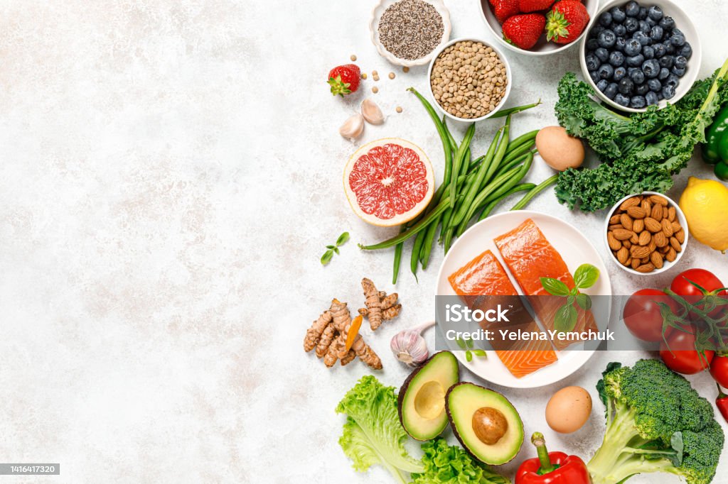 Healthy food. Healthy eating background. Salmon, fruit, vegetable and  berry. Superfood Healthy Eating Stock Photo