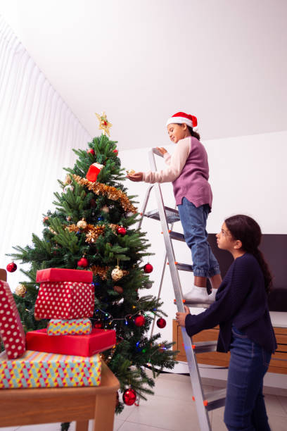 istock Children decorate a Christmas tree. 1416423138
