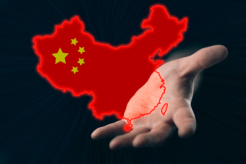 helping hand of china, map of china in hand on dark background
