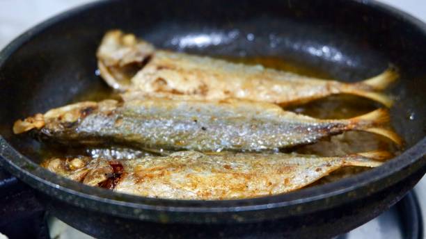 istock Fry 3 fish in a hot pan with boiling oil 1416425705