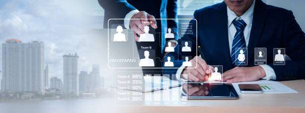 istock A computer tablet is pointed out by the two businessmen. Word team collaboration and leadership link for success, community and employee group with corporate, teamwork for collective thinking 1416427008