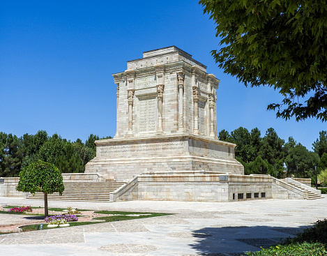 The Tomb of Ferdowsi is a tomb complex composed of a white marble base, and a decorative edifice erected in honor of the Persian poet Ferdowsi located in Tus, Iran, in Razavi Khorasan province. It was built in the early 1930s, under the regime of Reza Shah, and uses mainly elements of Achaemenid architecture to demonstrate Iran's rich culture and history. The construction of the mausoleum as well as its aesthetic design is a reflection of the cultural, and geo-political status of Iran at the time.