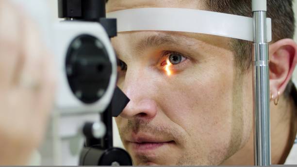 istock face close-up , man doing eye test with non contact tonometer, cheking vision, intraocular pressure at optical clinic, ophthalmilogical laboratory 1416437440