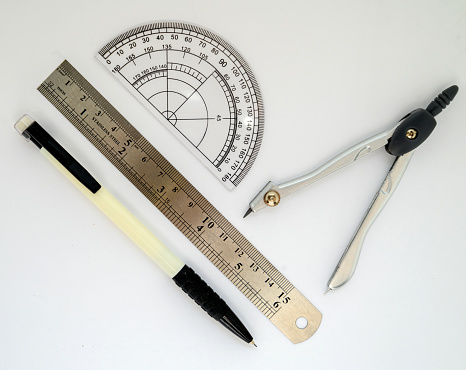 school stationery ruler pencil compasses and protractor isolates on white background for design