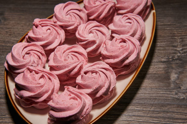 istock beautiful pink marshmallows on a plate close-up. marshmallow with cranberries 1416439501