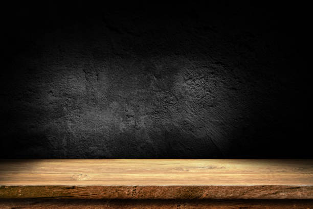 istock Wooden table in dark room background concept for advertising. 1416445012