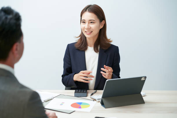 istock business woman giving a presentation 1416445150