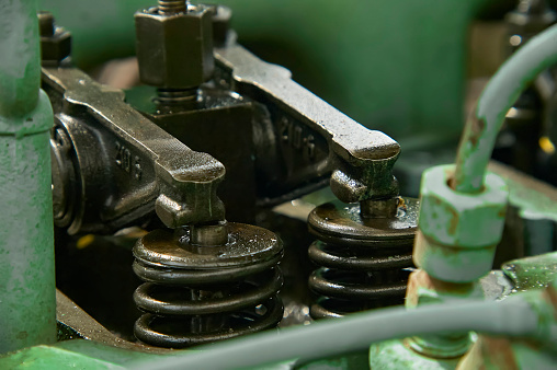 Detail of the suction and discharge valves of a Diesel engine while disassembled for repairs and maintenance.