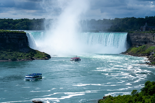 Niagara Falls, Ontario, Canada - July 10 2021 : Niagara Falls Cruise Boat Tour. Horseshoe Falls.