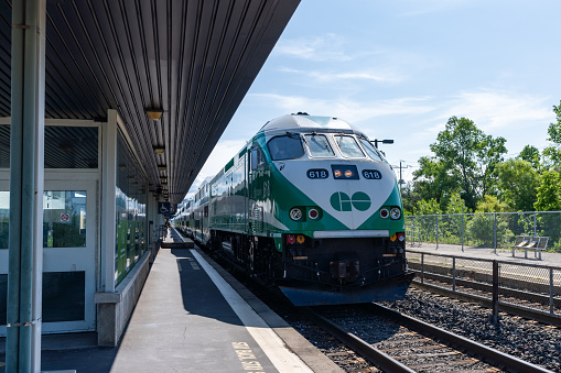 Burlington, Ontario, Canada - July 10 2021 : Go Train 618 arriving at Burlington GO Station platform.