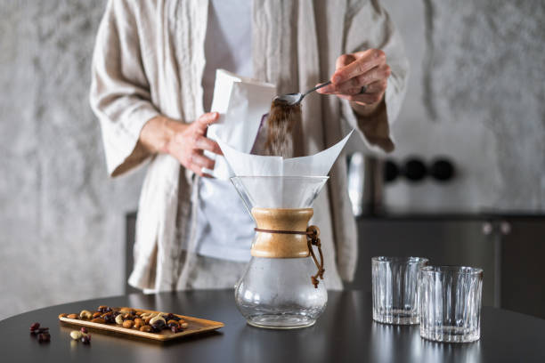 istock man prepare coffee in glass chemex at home kitchen 1416451243