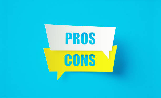 Pros And Cons Written Cut Out Yellow And White Speech Bubbles Sitting Over Blue Background Pros and cons written cut out yellow and white speech bubbles sitting on blue background. Horizontal composition with copy space. pros and cons stock pictures, royalty-free photos & images