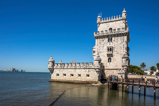 May 27, 2022, Lisbon, Portugal: A view of tourists lining up to visit the Belém Tower on the banks of the Tagus River.