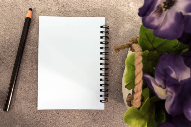 istock Note book with pen and potted plant on marble table. Directly above. Flat lay. Copy space. 1416464016