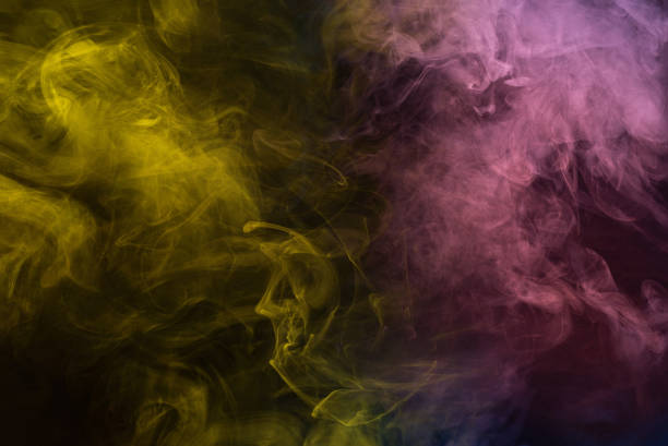 istock Yellow and pink steam on a black background. 1416468082