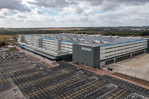Leeds, UK - August 19, 2022. Aerial view of a large Amazon Prime distribution warehouse at Gateway 45 near the M1 motorway in Leeds, UK