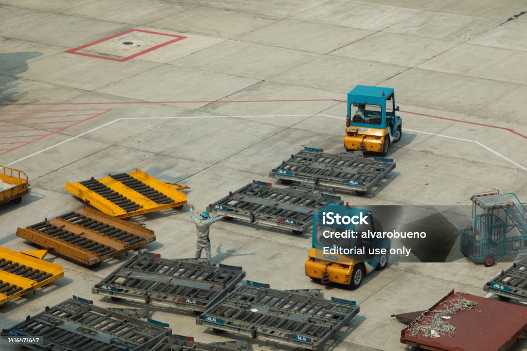 Cargo Tractor Units And Cargo Handler Workers In Noi Bai International