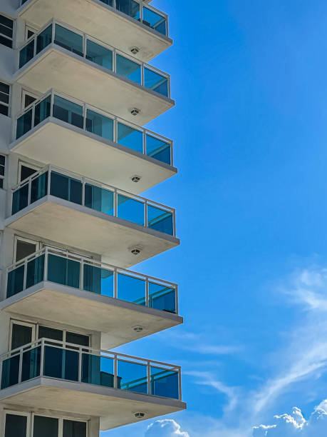 Florida High Rise Condo Patios Stacked Against Cobalt Blue Sky High Rise condo patios are stacked on top of each other against a South Florida cobalt blue sky. real estate outdoors vertical usa stock pictures, royalty-free photos & images