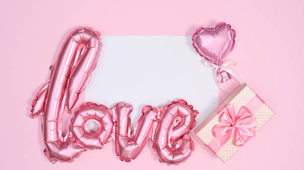 istock Copy space white paper with pink romantic balloons on pastel pink background. Flat lay VAlentine's day concept 1416473933