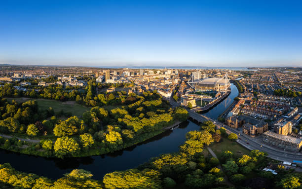 Cardiff United Kingdom aerial shot of City centre panorama with river and stadium Cardiff United Kingdom aerial shot of the City centre panorama with park foreground and the city stadium to the right of the image in the late afternoon light with a canal and the castle park in the foreground cardiff wales stock pictures, royalty-free photos & images