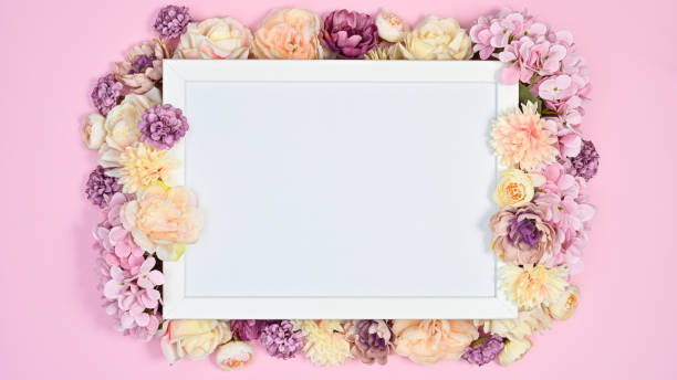 istock Copy space white paper with pink romantic flowers on pastel pink background. Flat lay VAlentine's day concept 1416475658