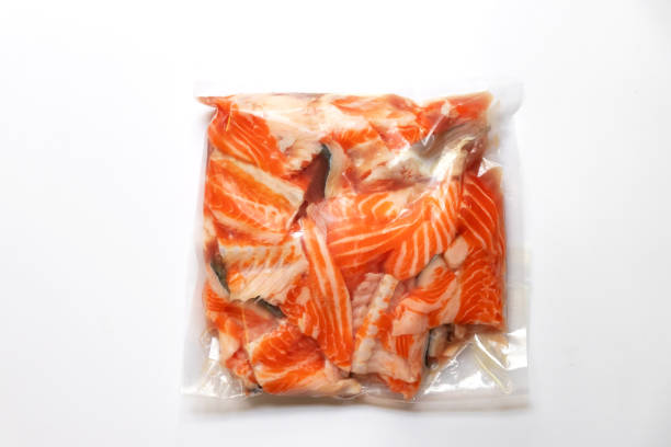 istock Salmon bone in vacuum package isolated on white background for delicious menu. Top view 1416476053